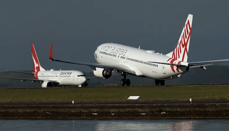 Qantas Jet Crosses Runway as Virgin Takes Off