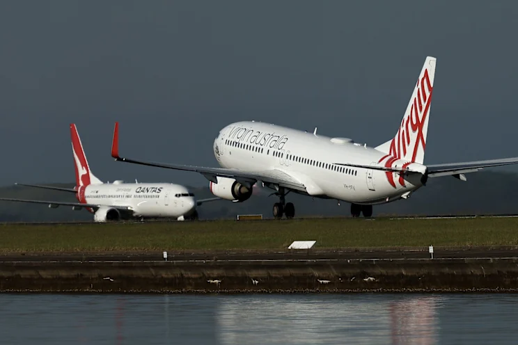 Qantas Jet Crosses Runway as Virgin Takes Off